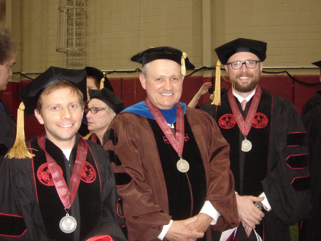 three men in academic regalia
