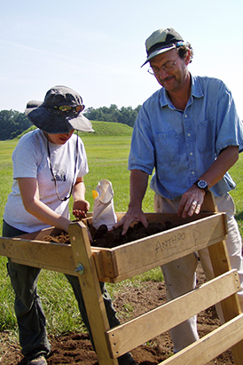 a student and professor working at Moundville Archaeological Park